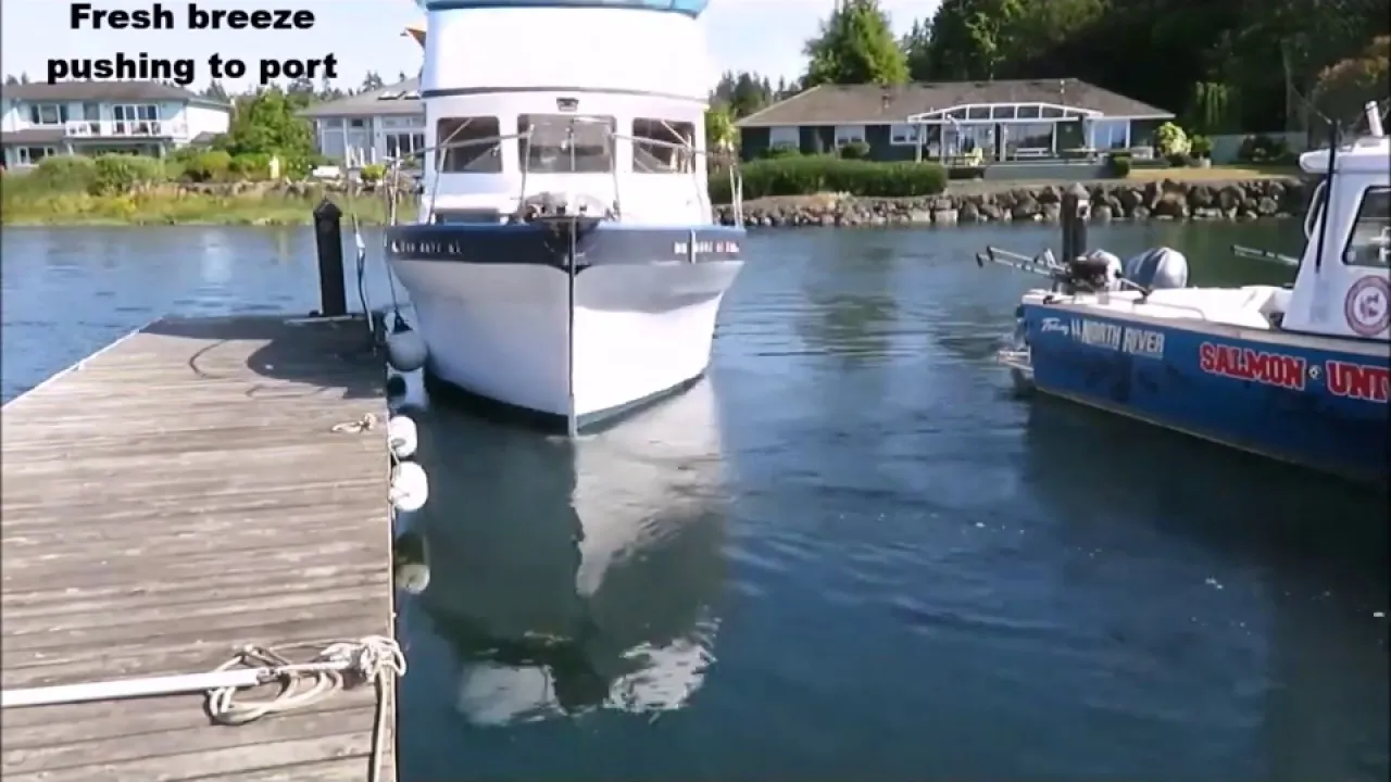 A still from DockStar's demo video: a white trawler coming bow-first into a dock, with the words Fresh breeze pushing to port on the screen.